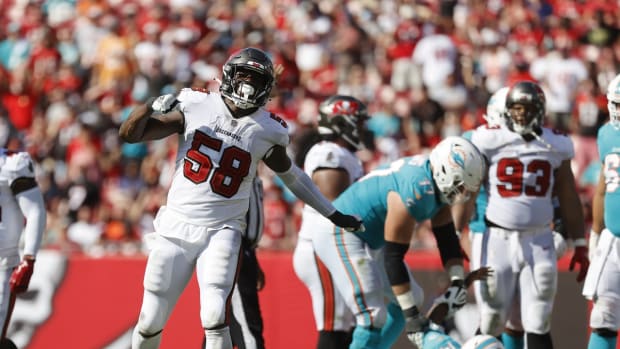 Oct 10, 2021; Tampa, Florida, USA; Tampa Bay Buccaneers outside linebacker Shaquil Barrett (58) sacks Miami Dolphins quarterback Jacoby Brissett (14) during the second half at Raymond James Stadium. Mandatory Credit: Kim Klement-USA TODAY Sports